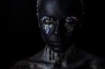 Girl In Black Makeup With Sparkles Stock Photo