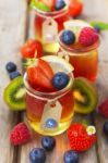 Red And Yellow Jelly Served With Fruit Stock Photo