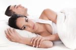 Man Sleeping And Woman Lying Sleepless Stock Photo