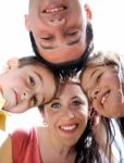 Closeup Portrait Of A Happy Family In Circle Stock Photo