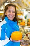 Woman Showing Round Cheese Stock Photo