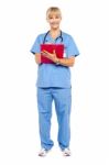 Medical Practitioner Posing With A Clipboard Stock Photo