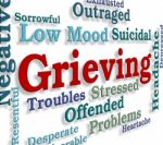 Grieving Word Represents Broken Hearted And Angst Stock Photo