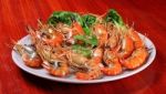 Plate Of Grilled Shrimps With Spicy Sauce Stock Photo