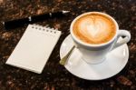 Open A Blank White Notebook, Pen And Cup Of Coffee On Marble Des Stock Photo