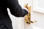 Cropped Image Of Female Hand Opening Door Stock Photo