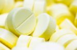Pharmacy Theme, Heap Of Yellow Round Medicine Tablet Antibiotic Pills. Shallow Dof Stock Photo