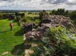 Woman Looking At Ancient Ruins Of Beeston Castle Stock Photo