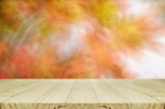 Pine Wood Counter With Blurred Autumn Leaves Background Stock Photo