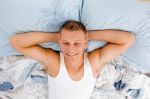Young Male Relaxing On His Bed Stock Photo