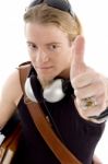 Student With Thumbs Up And Ear Buds Stock Photo