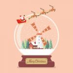 Merry Christmas Glass Ball With Santa Sleigh And Winter Rural Sc Stock Photo