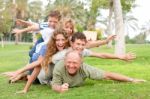 Happy Family Laying On Each Other Stock Photo