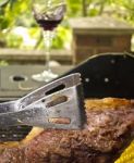 Cooking Steak On Barbecue Stock Photo