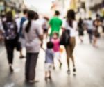 Blurred People Walking On The Street Stock Photo