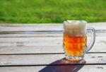 Glass Mug With Beer Standing On The Table Outdoor Stock Photo