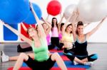 People Doing Stretching Exercise With Fitness Balls Stock Photo