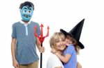 Young Boy And Cute Girl Participating In Halloween Celebration Stock Photo