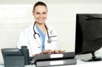 Female Doctor Typing On Keyboard Stock Photo