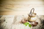 Tea Cups With Teapot On Old Wooden Table Stock Photo