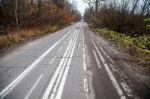 Old Abandoned Asphalt Road With Spoiled Road Markings Stock Photo