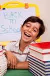 Smiling Boy With School Books Stock Photo