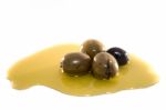 Green And Black Olives With Olive Oil Stock Photo