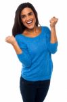 Excited Pretty Girl With Clenched Fists Stock Photo