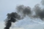 Black Smoke From Fire Burning On The Sky Stock Photo
