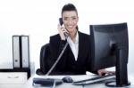 Smiling Woman Busy Over Phone Stock Photo