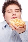 Chubby Man With French Fries Stock Photo