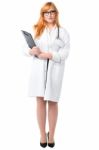 Young Lady Doctor Holding Clipboard Stock Photo