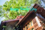 Happy Family Day Message On Wooden Tree House Background Stock Photo