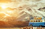Traveling Car Parking On Road Side Against Beautiful Snow Mountain Background Stock Photo