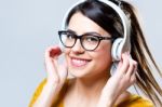 Beautiful Brunette Woman Listening To Music Stock Photo