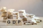 Gdp Word Written In Wooden Cube On Wood Table With Wooden Stack Stock Photo