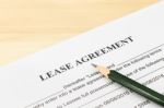Lease Agreement Contract Document And Pencil At Bottom Right Corner Stock Photo