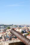 Cityscape Of Lisbon In Portugal With Cannon Weapon Stock Photo