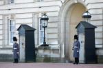 Guards In Greatcoats On Sentry Duty At Buckingham Palace Stock Photo