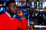 African Guy At Pub Stock Photo