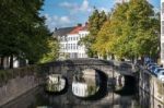 Bridge Over A Canal In Bruges West Flanders In Belgium Stock Photo