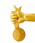 Gold Hand Holding Medal The Best Isolated On White Background Stock Photo