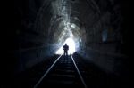 Man Standing In Train Tunnel Stock Photo
