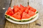 Seedless Watermelon Cut Into Wedges Serving On Dish Stock Photo