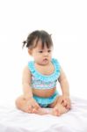 Portrait Baby Girl In Swimsuit On White Background Stock Photo