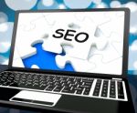 Seo On Laptop Shows Search Engine Optimization Stock Photo