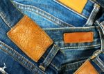 Grungy Leather Label On Jeans Stock Photo