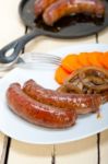 Beef Sausages Cooked On Iron Skillet Stock Photo