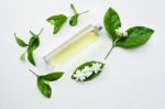 Essential Oil With Jasmine  Flower On White Background Stock Photo