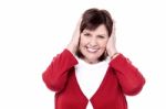 Senior Woman Closing Her Ears With Hands Stock Photo